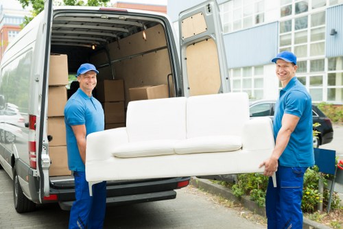 A man with van loading furniture in a Mayfair street