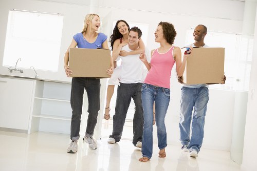 Professional packing team preparing fragile household items in a Mayfair property
