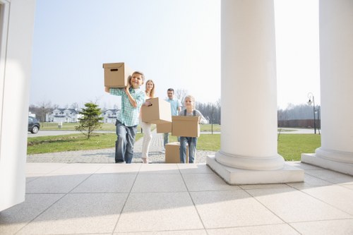 Removal company staff organizing items for transport
