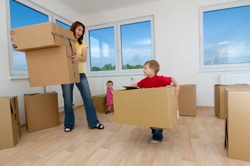Professional movers handling furniture in a Mayfair apartment move